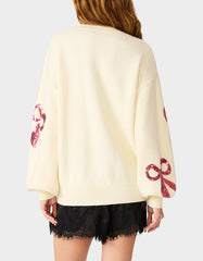 SEQUIN BOW SWEATER CREAM